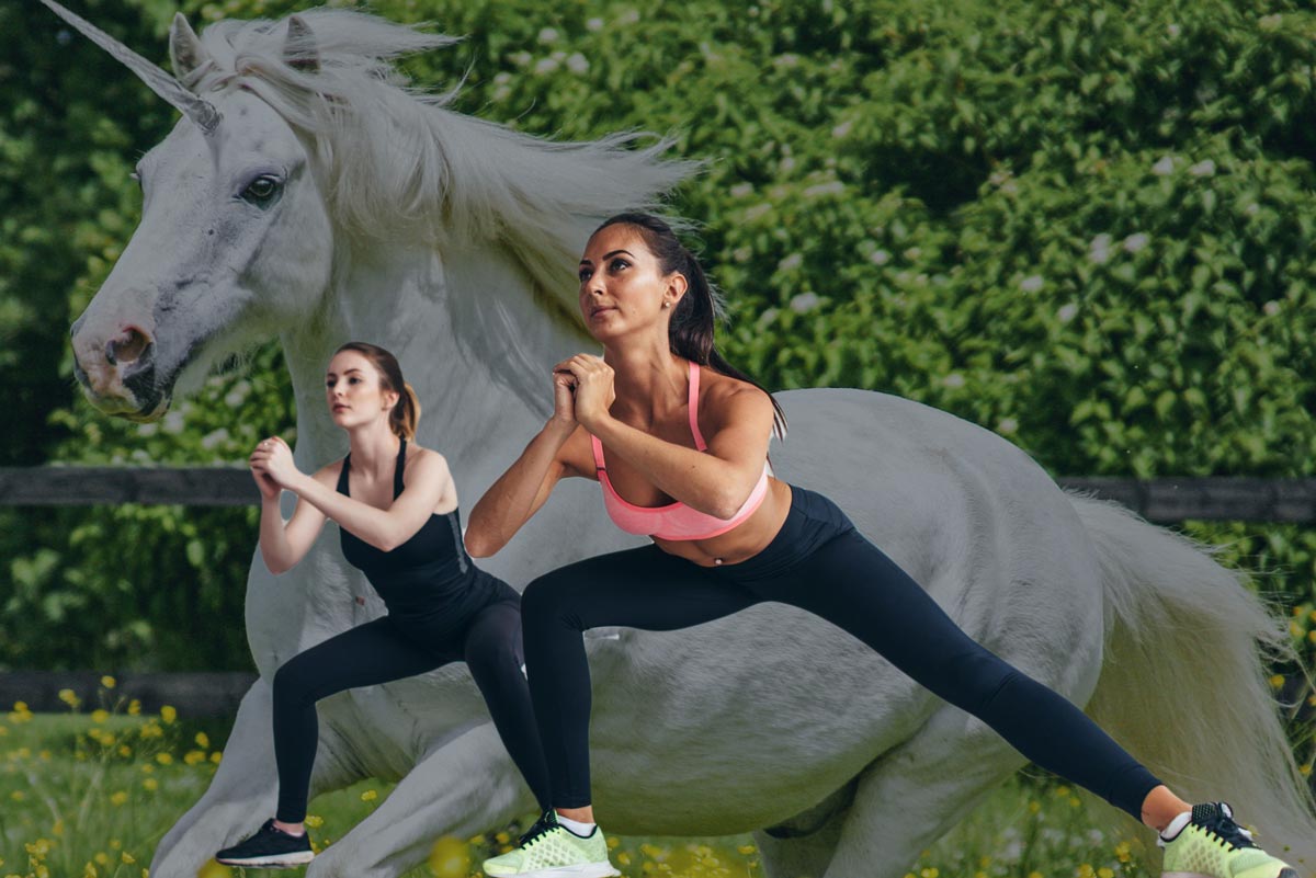 Two women doing exercise with a unicorn projected behind